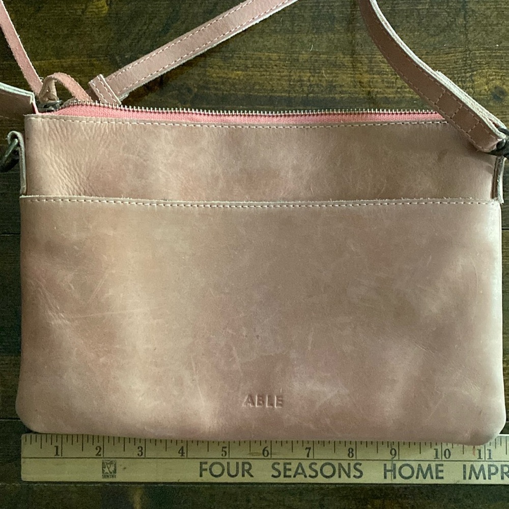 Able pink leather crossbody with adjustable strap. Great condition